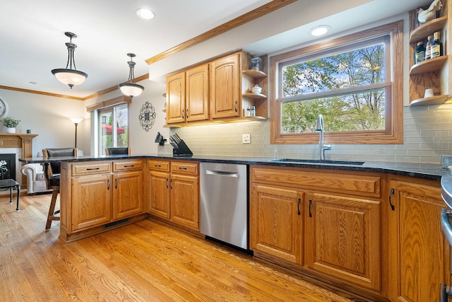 kitchen featuring crown molding, stainless steel dishwasher, open shelves, a sink, and a peninsula