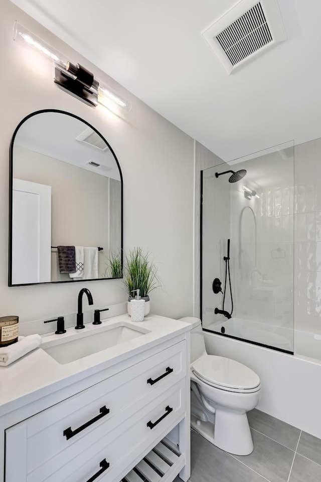 bathroom featuring washtub / shower combination, vanity, toilet, tile patterned floors, and visible vents