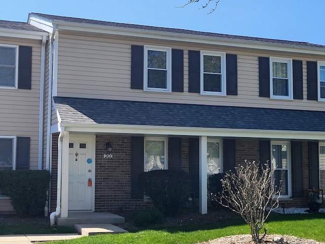 200 Rodenburg Rd, Roselle, IL 60172 - townhome / multi-family property featuring covered porch and brick siding
