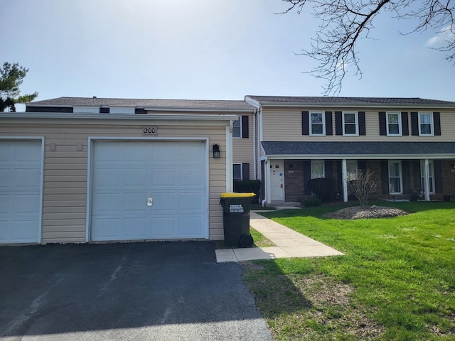 200 Rodenburg Rd, Roselle, IL 60172 - view of front of property with a garage, aphalt driveway, and a front yard