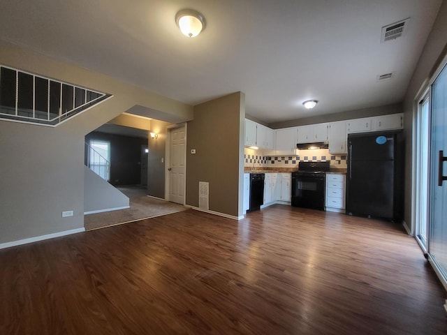 200 Rodenburg Rd, Roselle, IL 60172 - unfurnished living room featuring baseboards, visible vents, and dark wood finished floors
