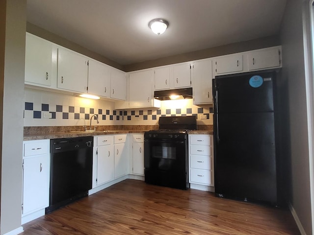 200 Rodenburg Rd, Roselle, IL 60172 - kitchen with decorative backsplash, a sink, black appliances, under cabinet range hood, and dark wood-type flooring