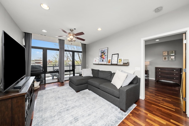 living area featuring visible vents, wood finished floors, a ceiling fan, and recessed lighting