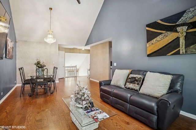 454 Kilkenny Ct Unit 454, Carol Stream, IL 60188 - living area with high vaulted ceiling, wood finished floors, baseboards, and a chandelier