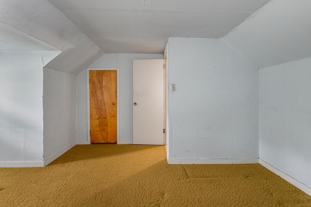 bonus room with baseboards, carpet, and lofted ceiling