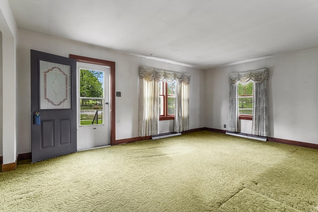 interior space featuring baseboards and a baseboard heating unit