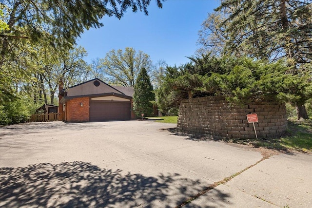 33 Half Day Rd, Lincolnshire, IL 60069 - garage with fence and concrete driveway