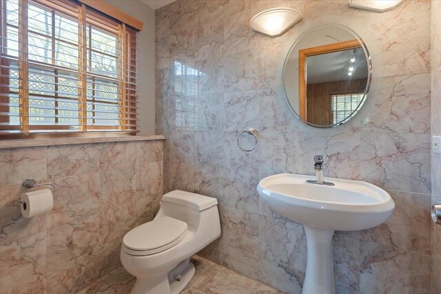 33 Half Day Rd, Lincolnshire, IL 60069 - bathroom with tile walls, toilet, and marble finish floors