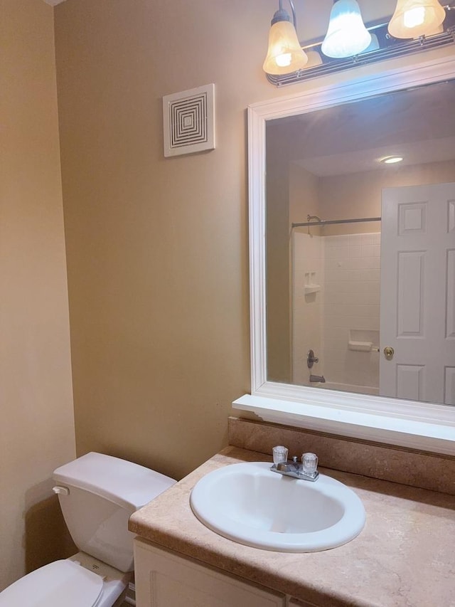 full bathroom featuring toilet and vanity