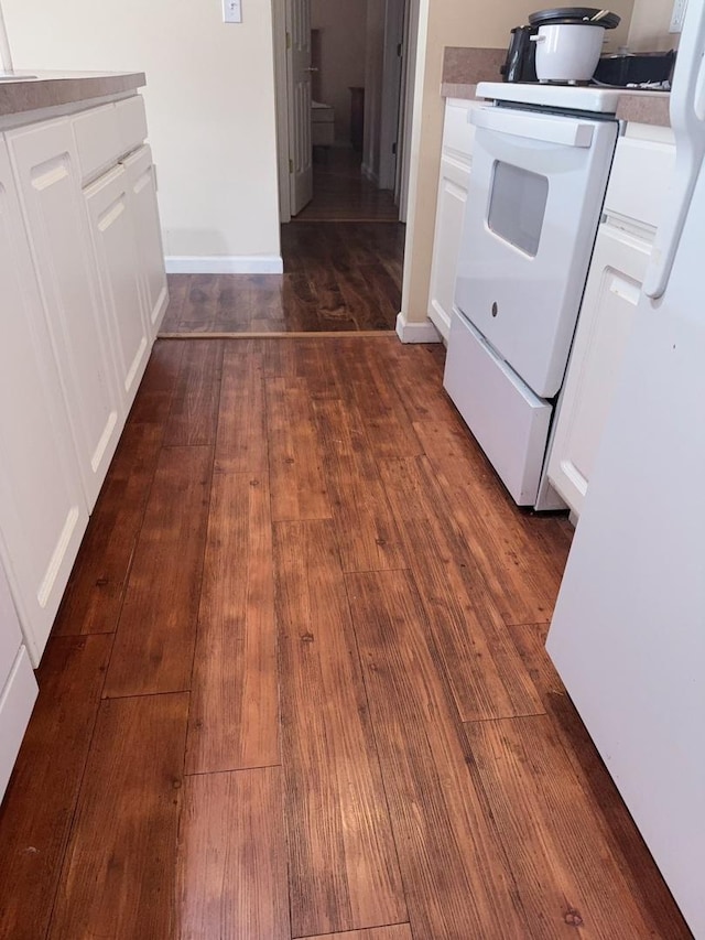 interior space with baseboards and dark wood finished floors