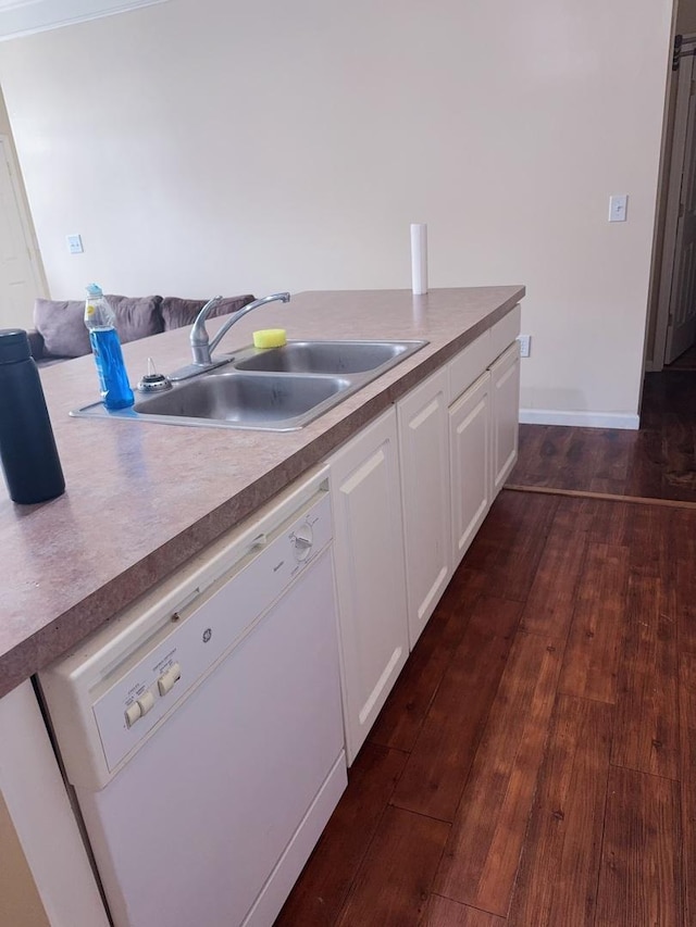 kitchen featuring a sink, dark wood-type flooring, white dishwasher, and white cabinets