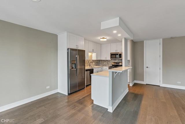 400 E Randolph St Unit 3428, Chicago, IL 60601 - kitchen featuring light countertops, appliances with stainless steel finishes, baseboards, and white cabinetry