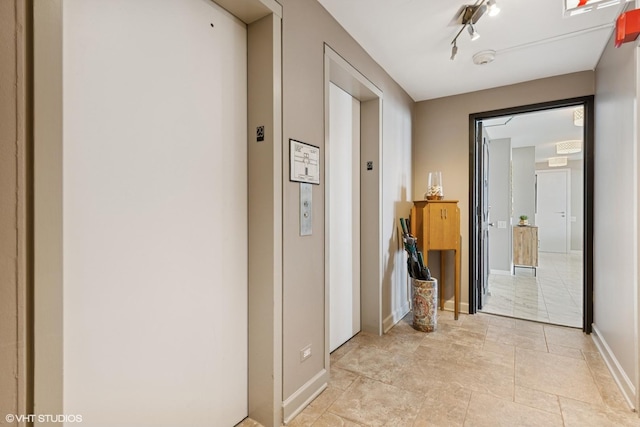 5733 N Sheridan Rd Unit 29D, Chicago, IL 60660 - corridor with elevator and baseboards