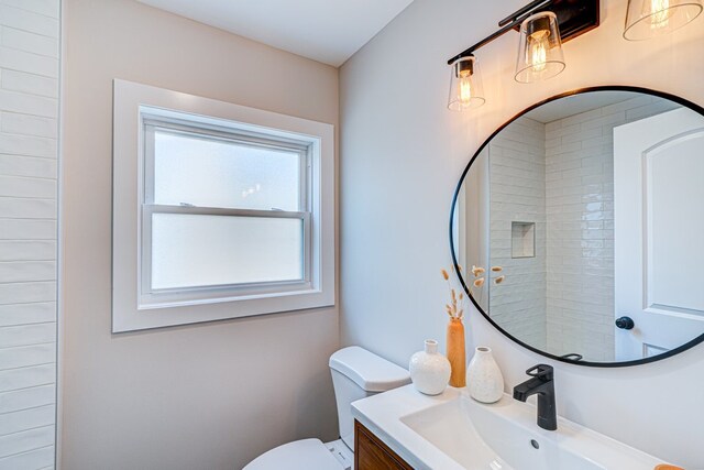 full bathroom featuring toilet and vanity