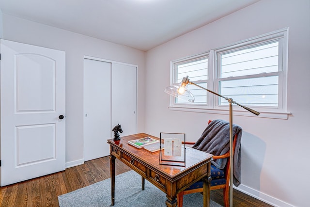 office area featuring baseboards and wood finished floors