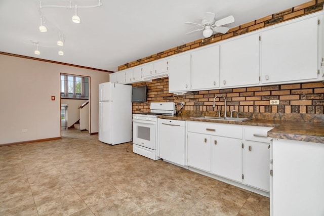 kitchen with white appliances, ceiling fan, a sink, backsplash, and white cabinets