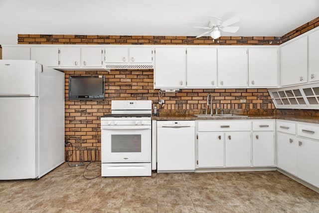 kitchen with a sink, white appliances, ceiling fan, white cabinetry, and dark countertops