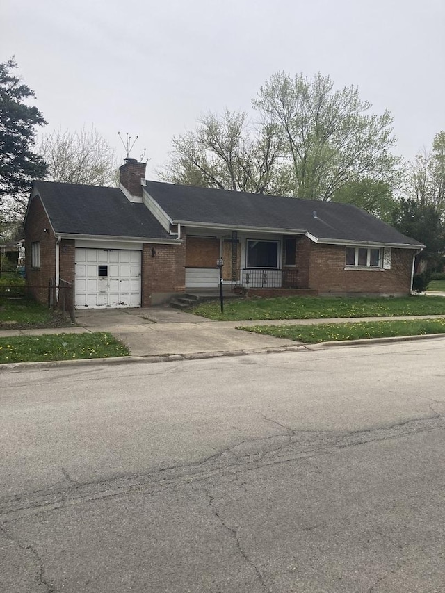 14201 S Wentworth Ave, Riverdale, IL 60827 - ranch-style house with a chimney, brick siding, concrete driveway, an attached garage, and a porch