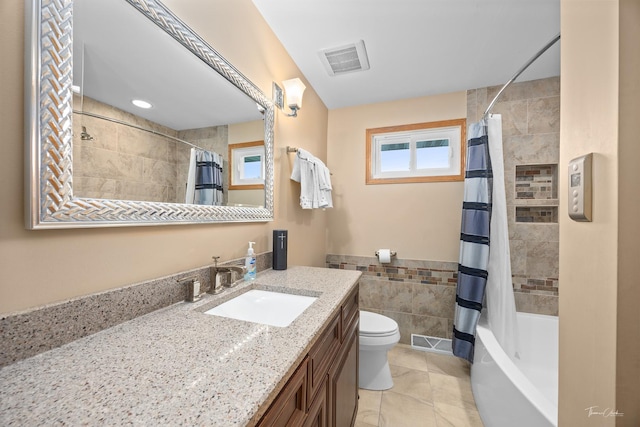 bathroom with tile walls, toilet, vanity, and shower / bathtub combination with curtain