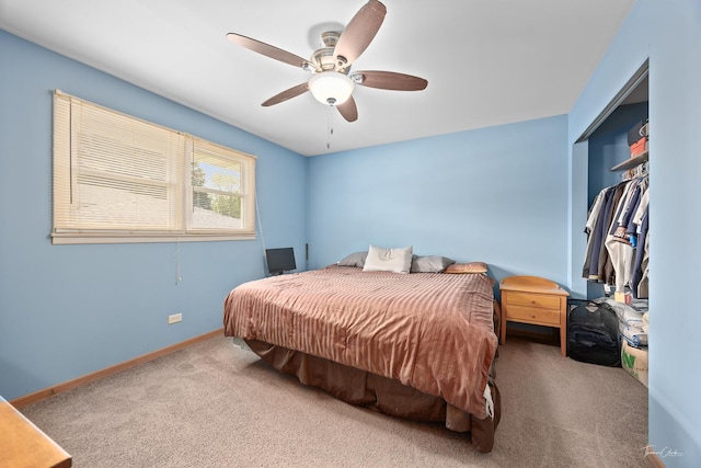bedroom featuring carpet, baseboards, a ceiling fan, and a closet