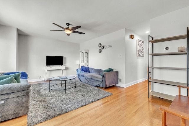 living room with ceiling fan, wood finished floors, baseboards, and recessed lighting