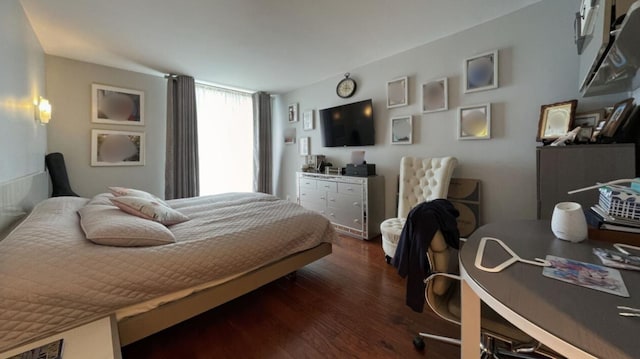 bedroom featuring dark wood-style flooring and visible vents