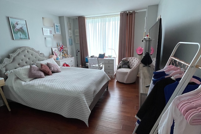 bedroom with dark wood finished floors