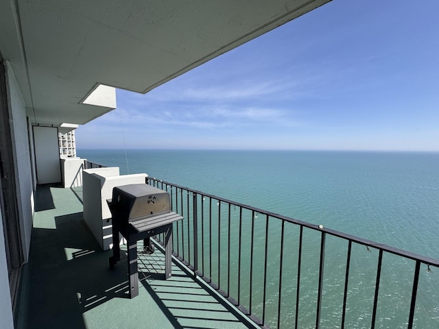 balcony featuring a water view