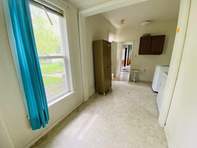 bathroom with baseboards and independent washer and dryer