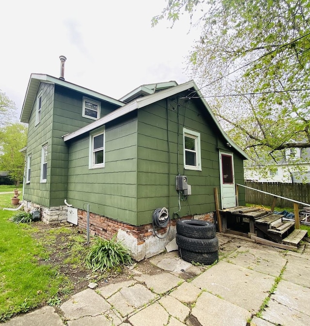 rear view of property with fence