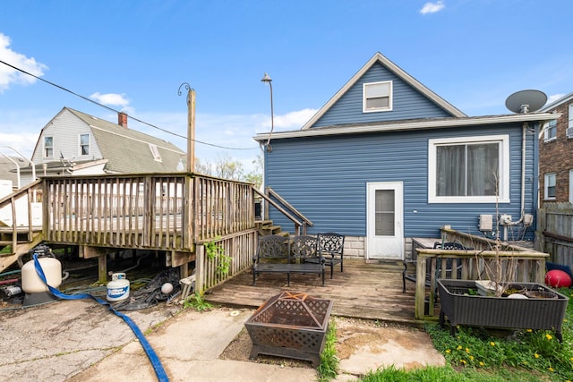 37 Mckinley Ave, Steger, IL 60475 - rear view of property with a fire pit, a wooden deck, and fence