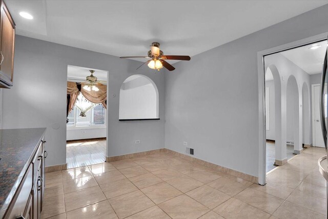8440 163rd St, Tinley Park, IL 60487 - unfurnished dining area featuring a ceiling fan, arched walkways, light tile patterned floors, baseboards, and recessed lighting