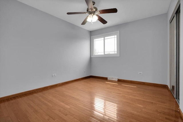 8440 163rd St, Tinley Park, IL 60487 - unfurnished bedroom with visible vents, a closet, baseboards, light wood-type flooring, and a ceiling fan