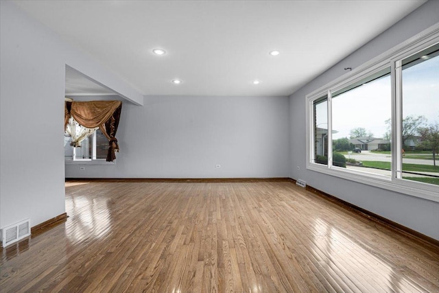 8440 163rd St, Tinley Park, IL 60487 - unfurnished living room featuring visible vents, baseboards, and wood finished floors