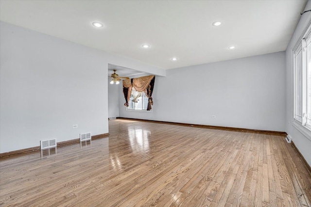 8440 163rd St, Tinley Park, IL 60487 - empty room with visible vents, light wood-style floors, ceiling fan, and baseboards