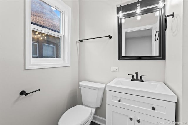 half bath with vanity and toilet