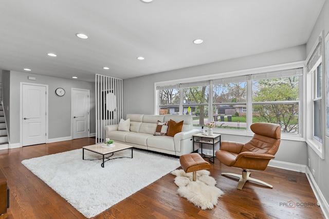 living area with stairs, recessed lighting, baseboards, and dark wood finished floors