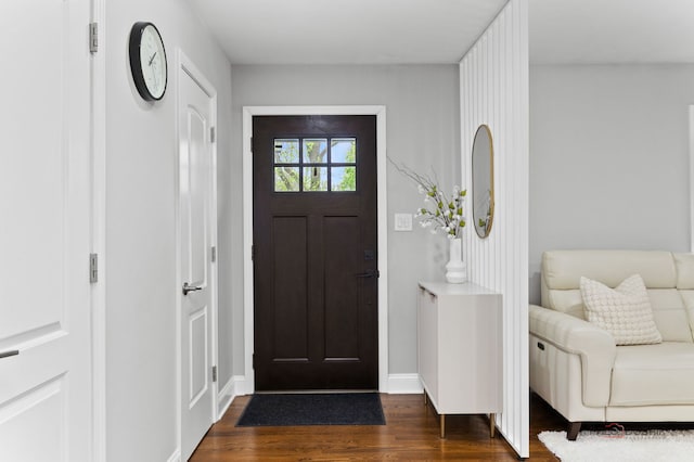 entryway with baseboards and dark wood-style floors
