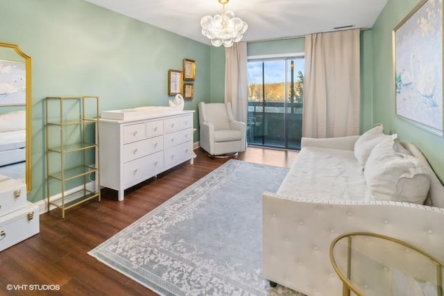 interior space featuring an inviting chandelier and wood finished floors