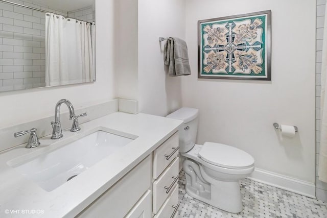 bathroom with vanity, baseboards, toilet, and curtained shower