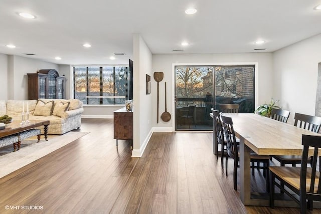 dining room featuring recessed lighting, baseboards, and dark wood-style floors