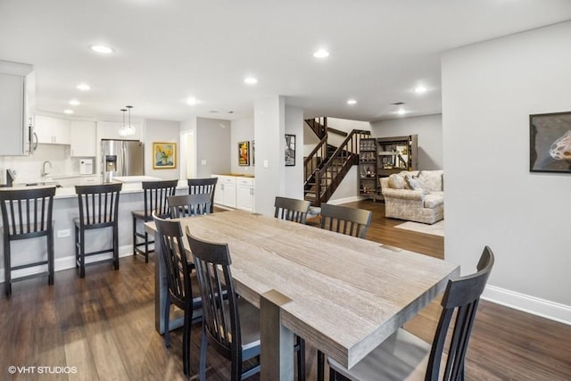 dining space with stairs, recessed lighting, baseboards, and dark wood finished floors