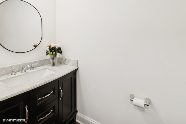 bathroom featuring vanity and baseboards