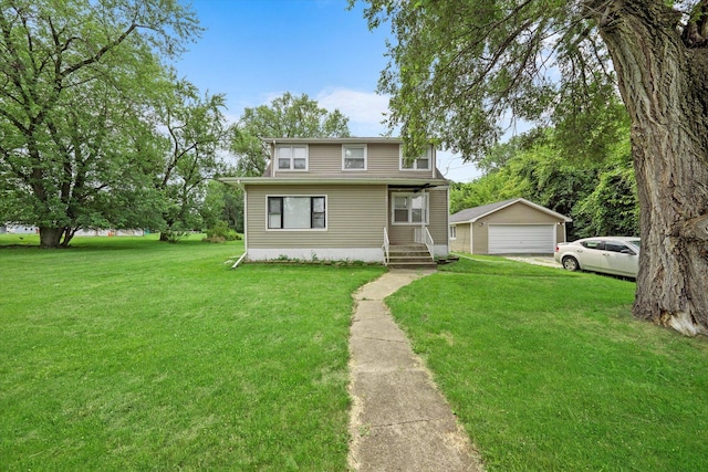 view of front of property with a garage, an outbuilding, and a front yard