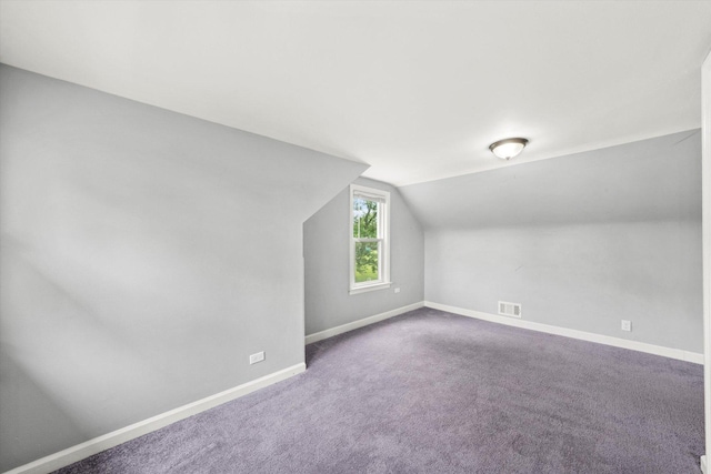 bonus room with visible vents, carpet flooring, baseboards, and lofted ceiling