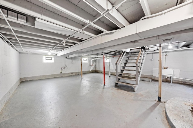 basement featuring stairs