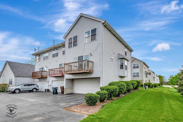 1372 Fox Hound Trl, Beecher, IL 60401 - back of house featuring an attached garage, a yard, driveway, and a balcony