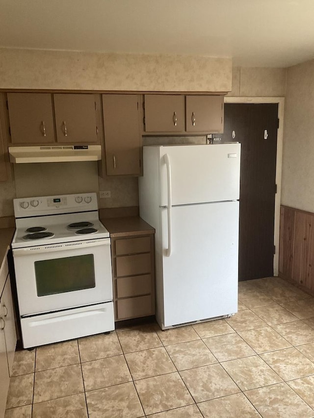 3010 Bernice Rd Unit 104, Lansing, IL 60438 - kitchen with white appliances, under cabinet range hood, and light tile patterned flooring