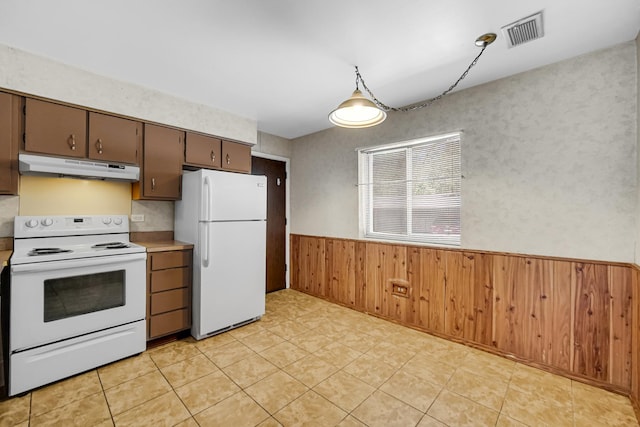 3010 Bernice Rd Unit 104, Lansing, IL 60438 - kitchen with white appliances, under cabinet range hood, wainscoting, wood walls, and light countertops