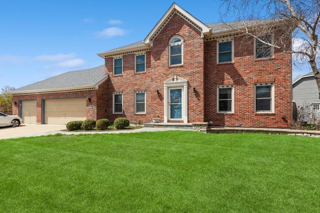 colonial house with brick siding, an attached garage, driveway, and a front yard